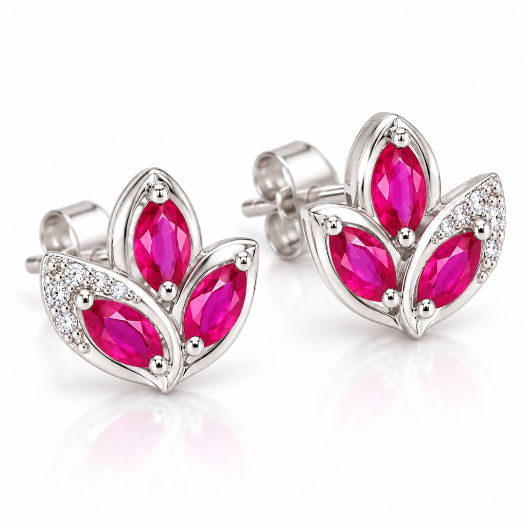 Angled view of Phimsera natural pink ruby marquise stud earrings with three elongated pink ruby gemstones and floral-inspired metalwork.