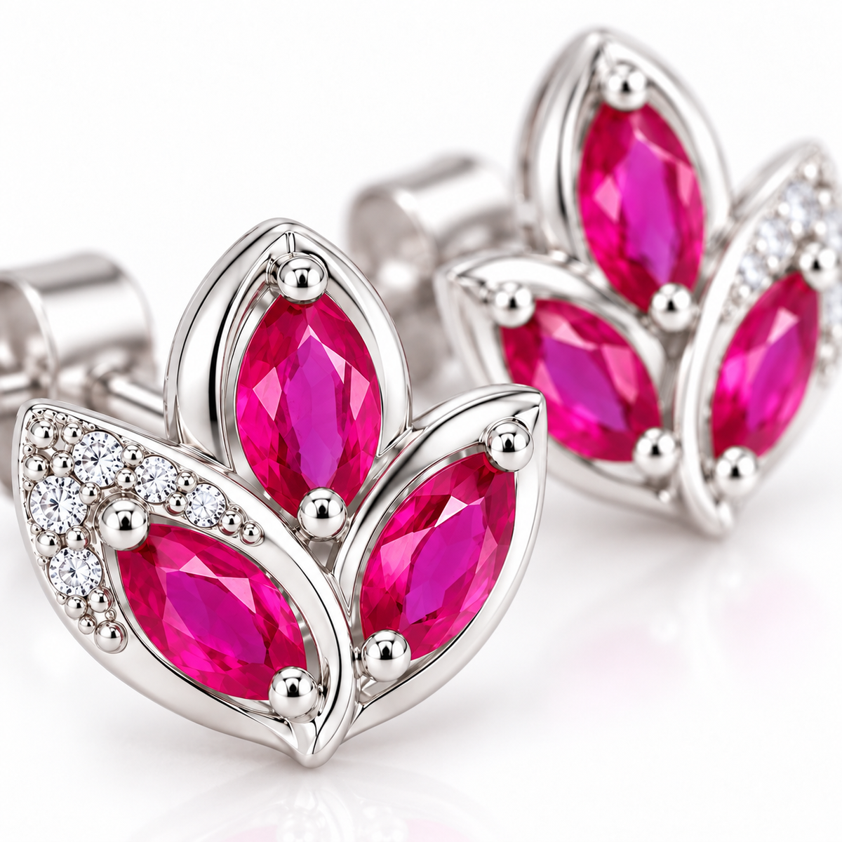 Macro detail of vivid pink natural ruby marquise gemstones measuring 2.5×5mm with faceted surfaces and surrounding accent details.