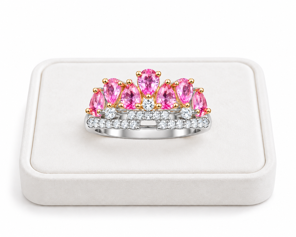 3x4mm pink sapphire crown ring displayed on a white velvet jewelry tray