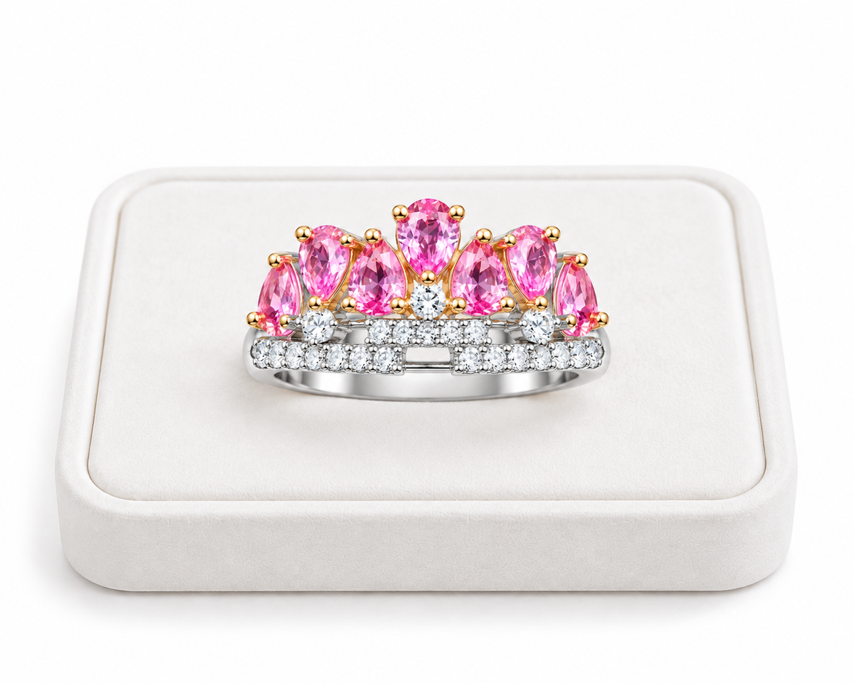 3x4mm pink sapphire crown ring displayed on a white velvet jewelry tray