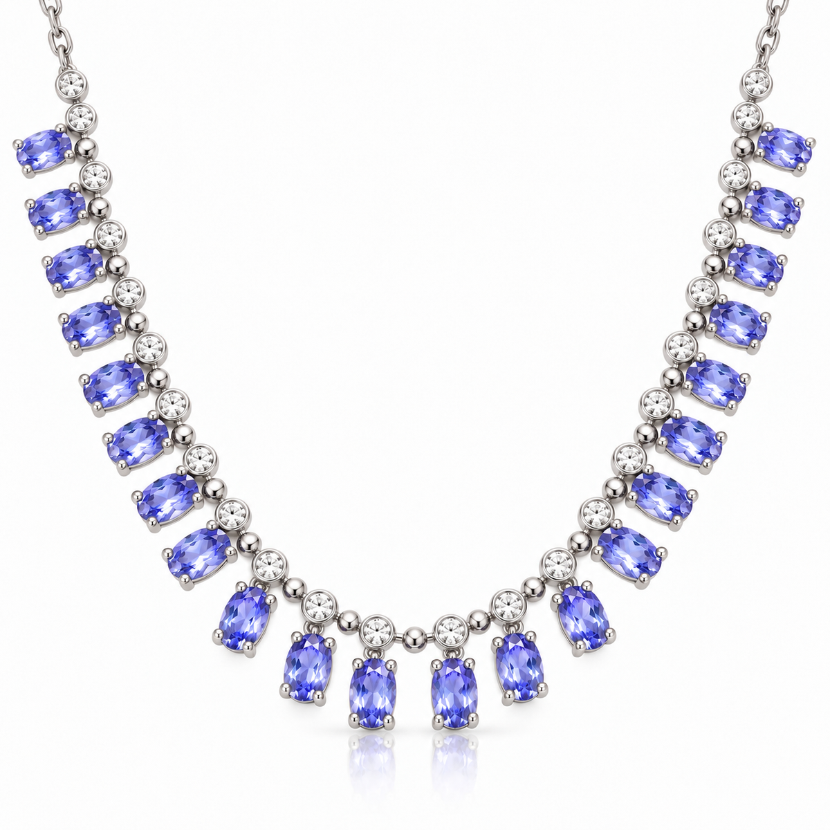 Natural purple tanzanite necklace featuring multiple 3×5mm oval gemstones in a 925 Sterling Silver setting on a white background