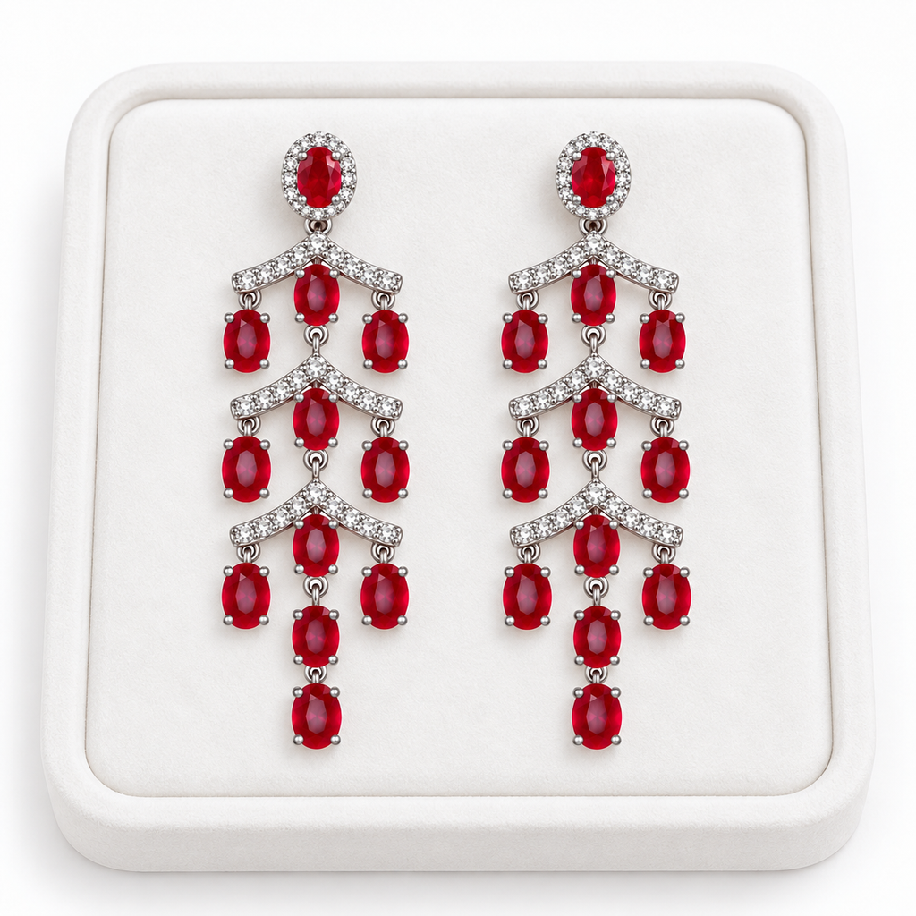 Phimsera natural ruby chandelier earrings displayed on a white jewelry tray, highlighting the cascading ruby and cubic zirconia design.
