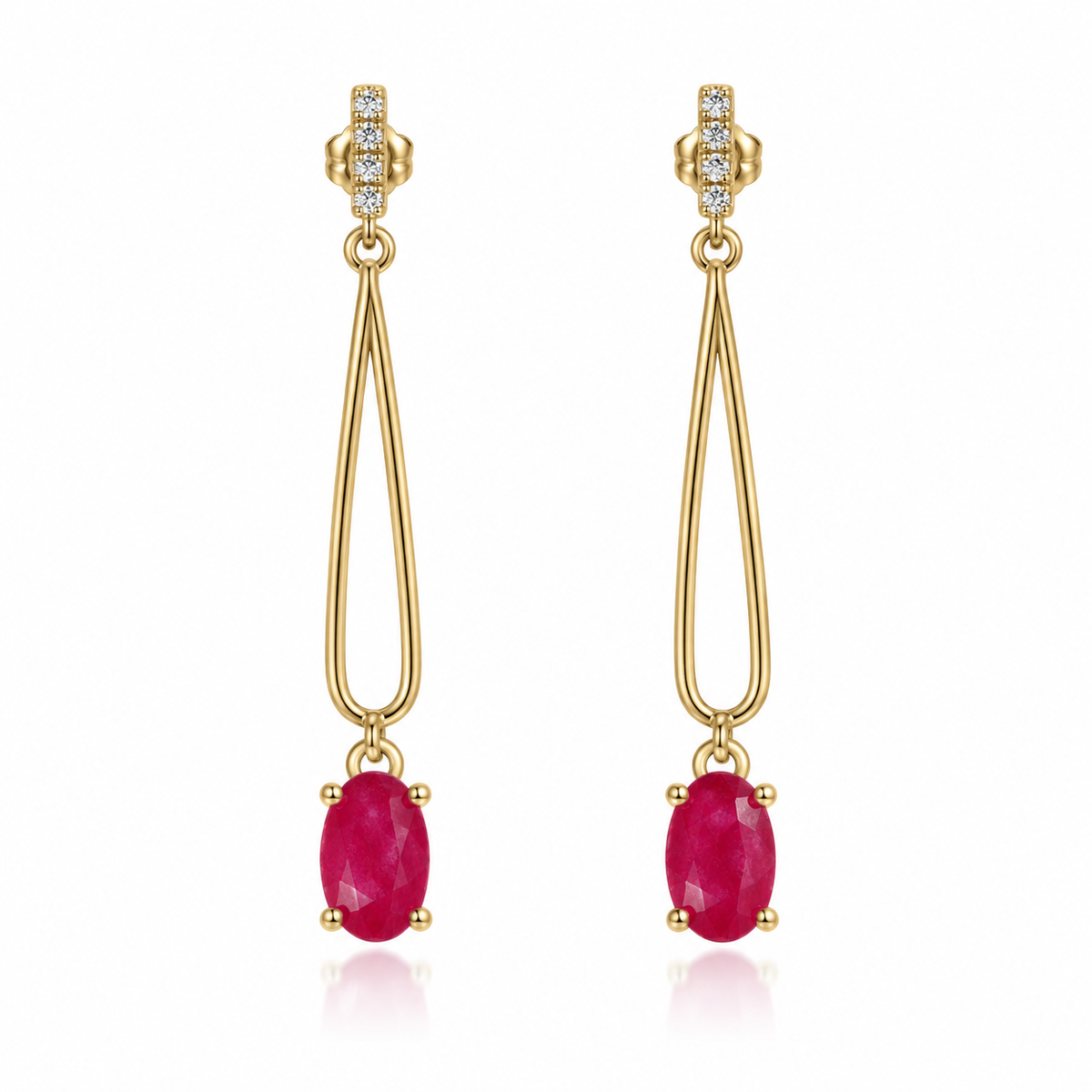 Phimsera natural ruby drop earrings featuring matching 4 × 6 mm oval pinkish-crimson ruby gemstones and long polished gold-tone loop designs on a white background.