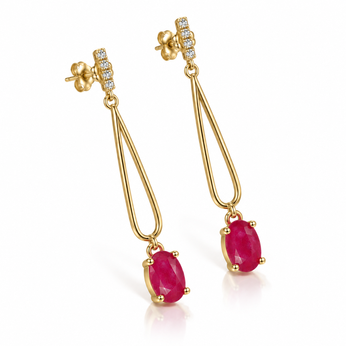 Angled view of Phimsera natural ruby drop earrings with 4 × 6 mm oval ruby gemstones, elongated loop details, and decorative clear accent stones.