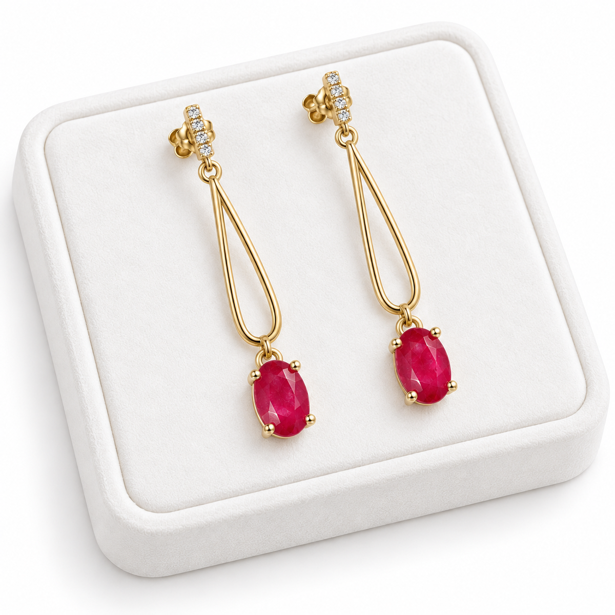 Phimsera natural ruby drop earrings displayed on a premium white velvet jewelry tray.