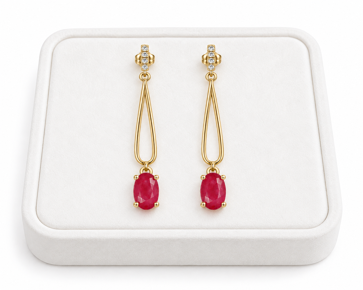 Phimsera natural ruby drop earrings displayed on a premium white velvet jewelry tray.