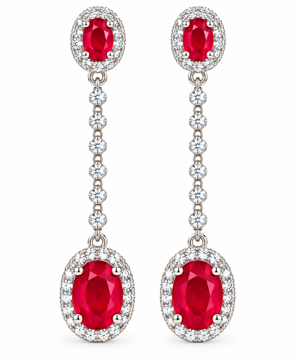 Macro view of the vivid red oval ruby gemstones and clear accent stones on Phimsera drop earrings