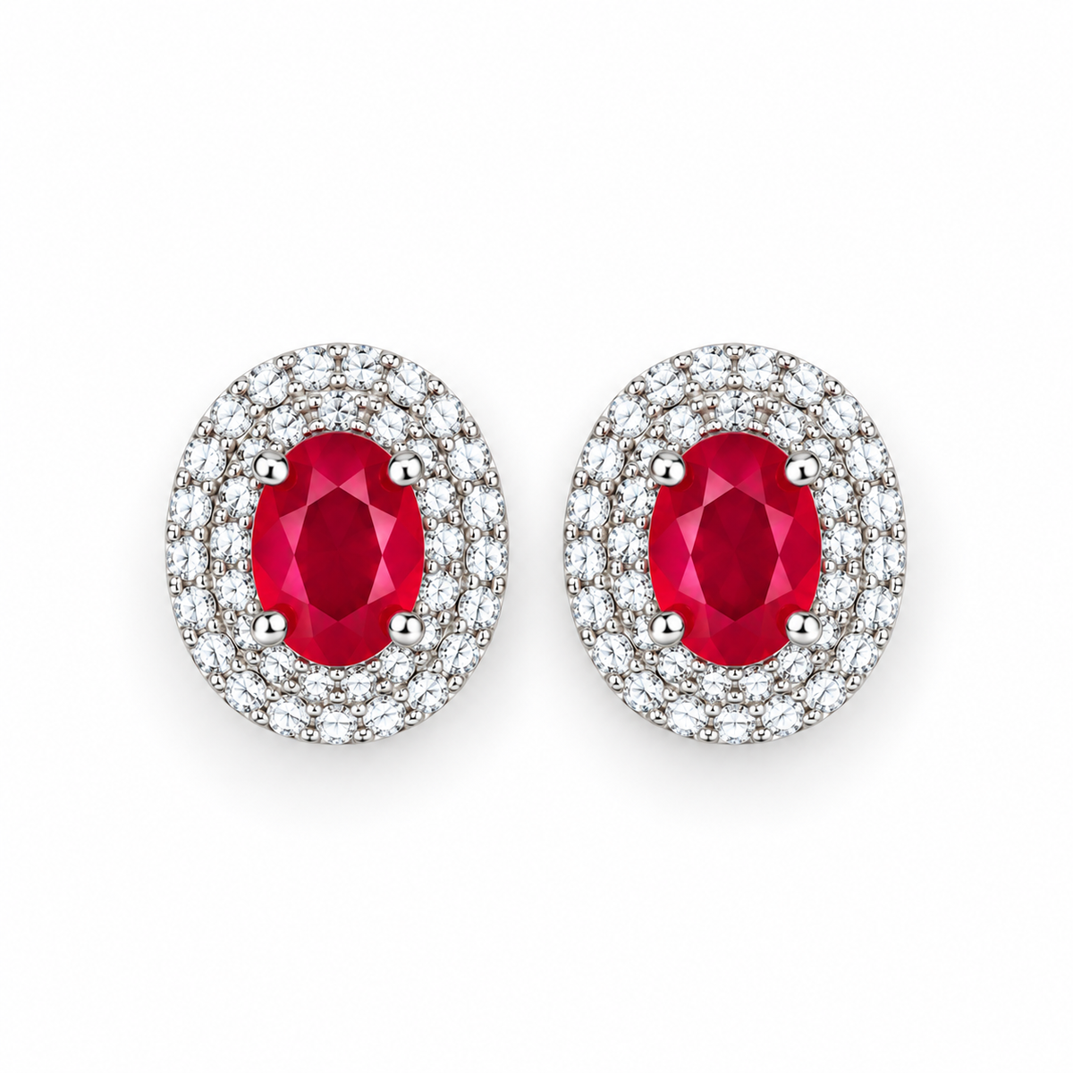 Top-down view of Phimsera natural ruby stud earrings with 4×5mm oval ruby gemstones and surrounding cubic zirconia accents in 925 Sterling Silver.