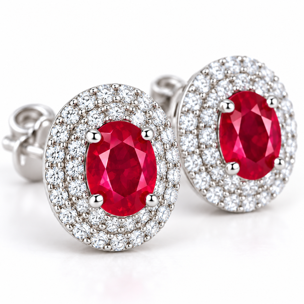 Macro close-up of Phimsera natural 4×5mm oval ruby gemstones surrounded by sparkling cubic zirconia accents, highlighting the red gemstone color and jewelry craftsmanship.