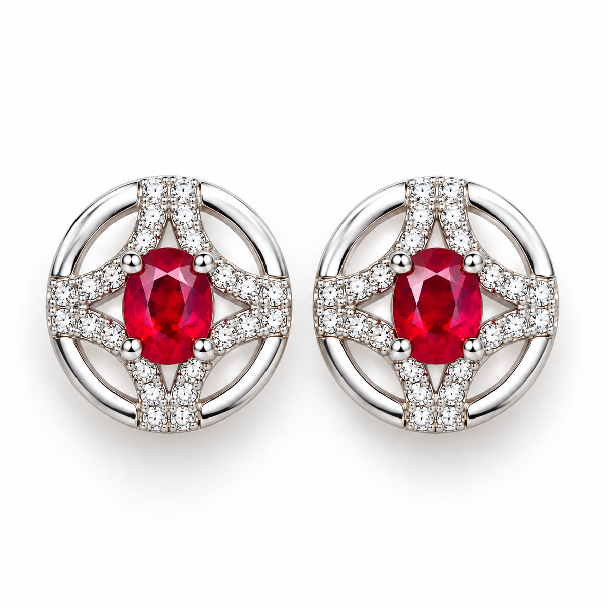 Top-down view of matching natural ruby stud earrings with 3 × 4mm oval red gemstones and detailed openwork settings.