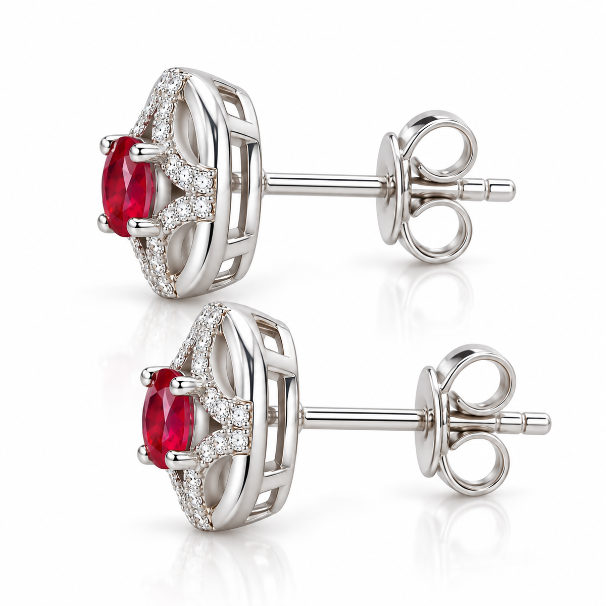 Side profile of Phimsera natural ruby stud earrings showing the setting depth, circular openwork design, and 3 × 4mm oval ruby gemstones.