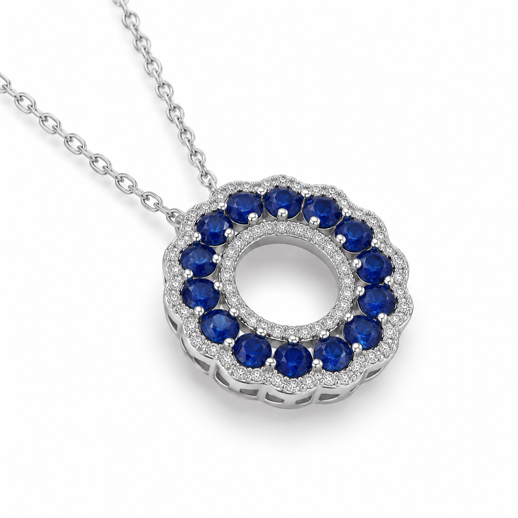 Angled view of 3mm natural sapphire necklace with circular blue sapphire pendant