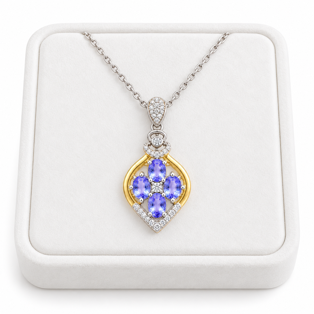 Natural tanzanite floral cross-inspired necklace displayed on a white jewelry tray against a white background