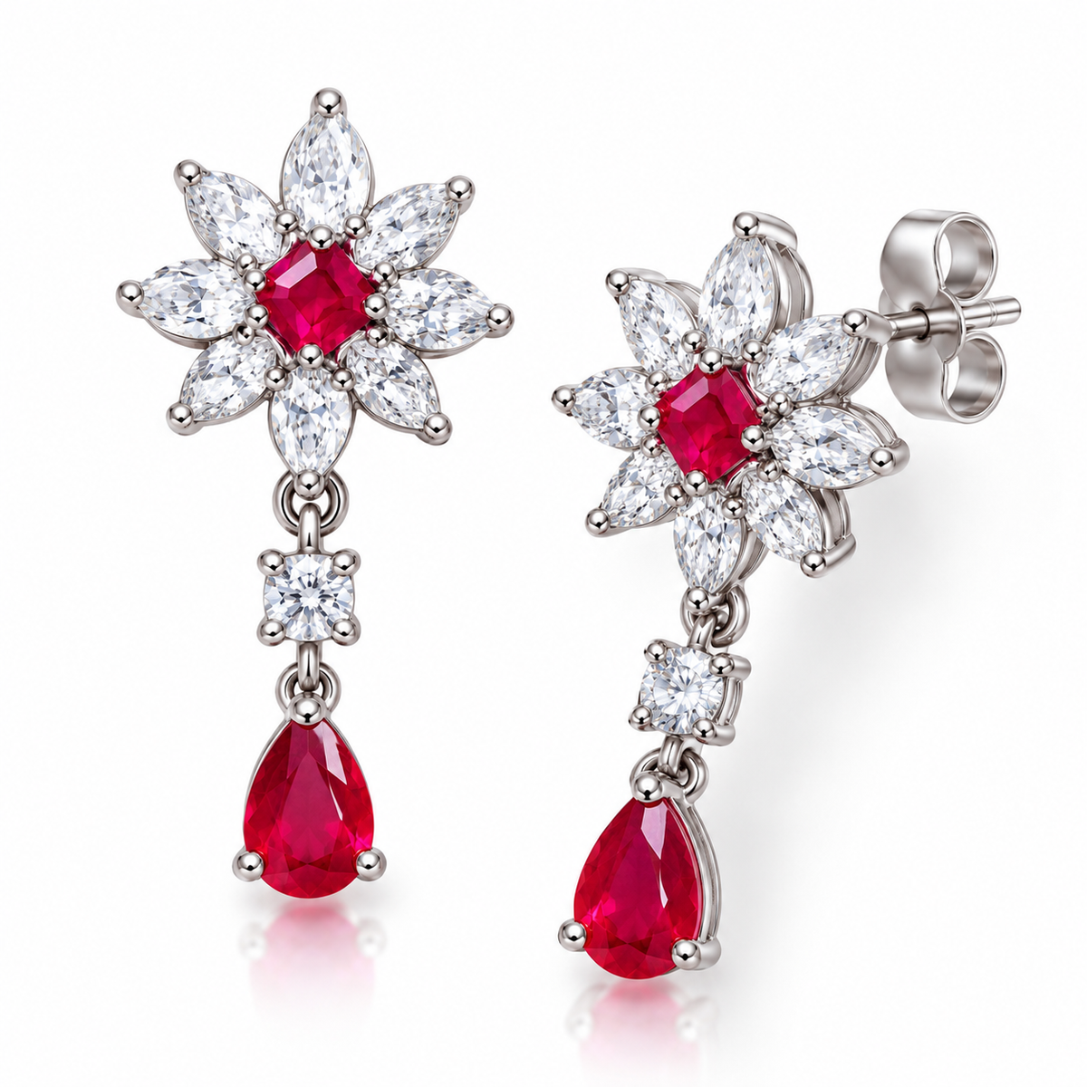 Angled view of Phimsera ruby floral drop earrings featuring square ruby centerstones, pear-cut ruby drops, and sparkling cubic zirconia details.