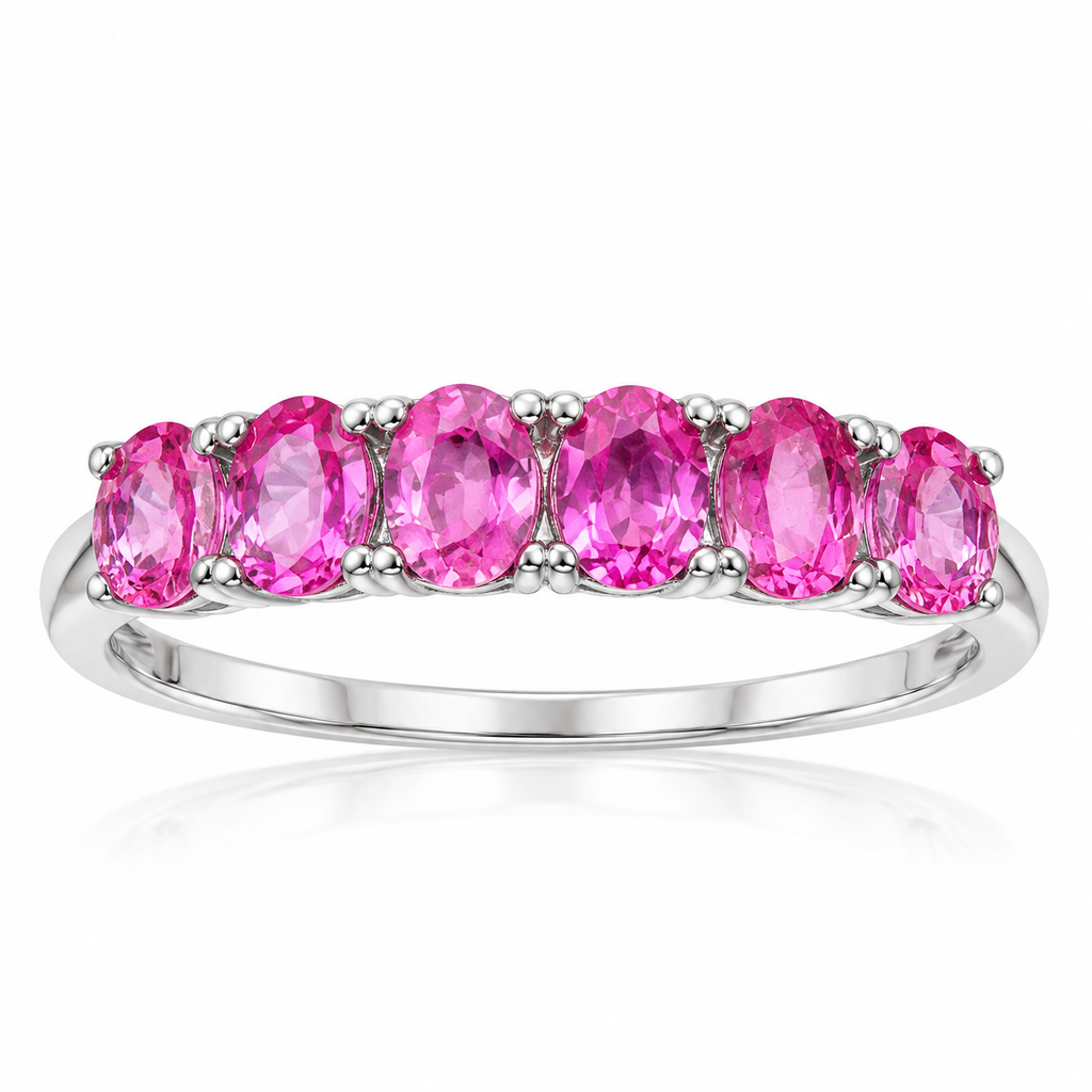 Natural pink sapphire band ring with 3x4mm pink gemstones in 925 sterling silver on a white background.