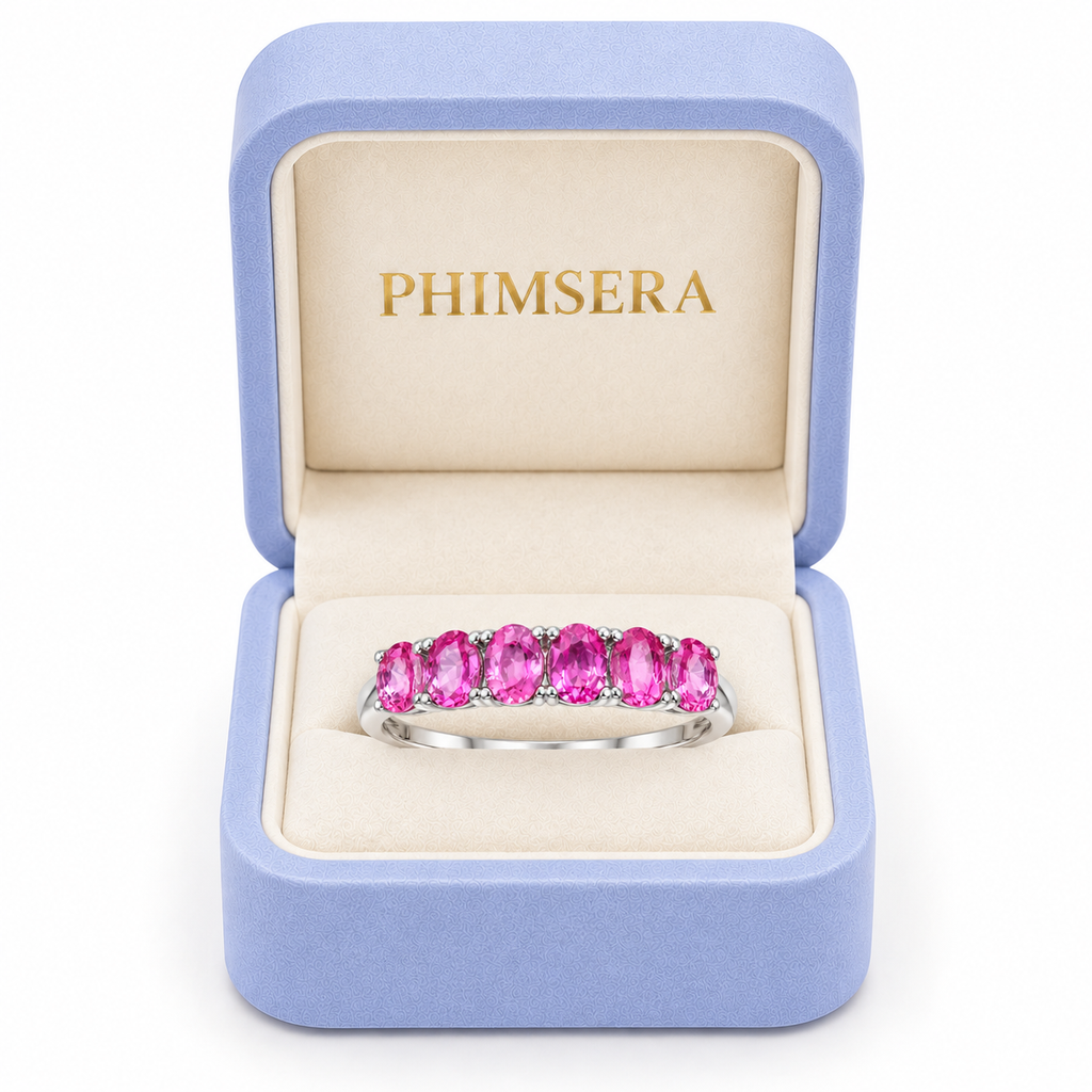 Phimsera natural pink sapphire band ring presented in a luxury jewelry box.