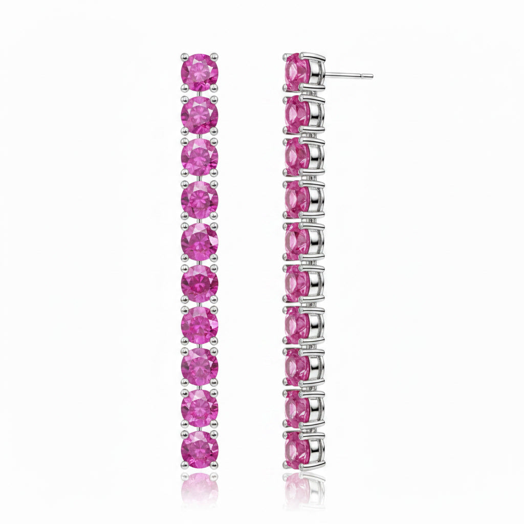 Natural Pink Sapphire dangle earrings shown from a three-quarter angle