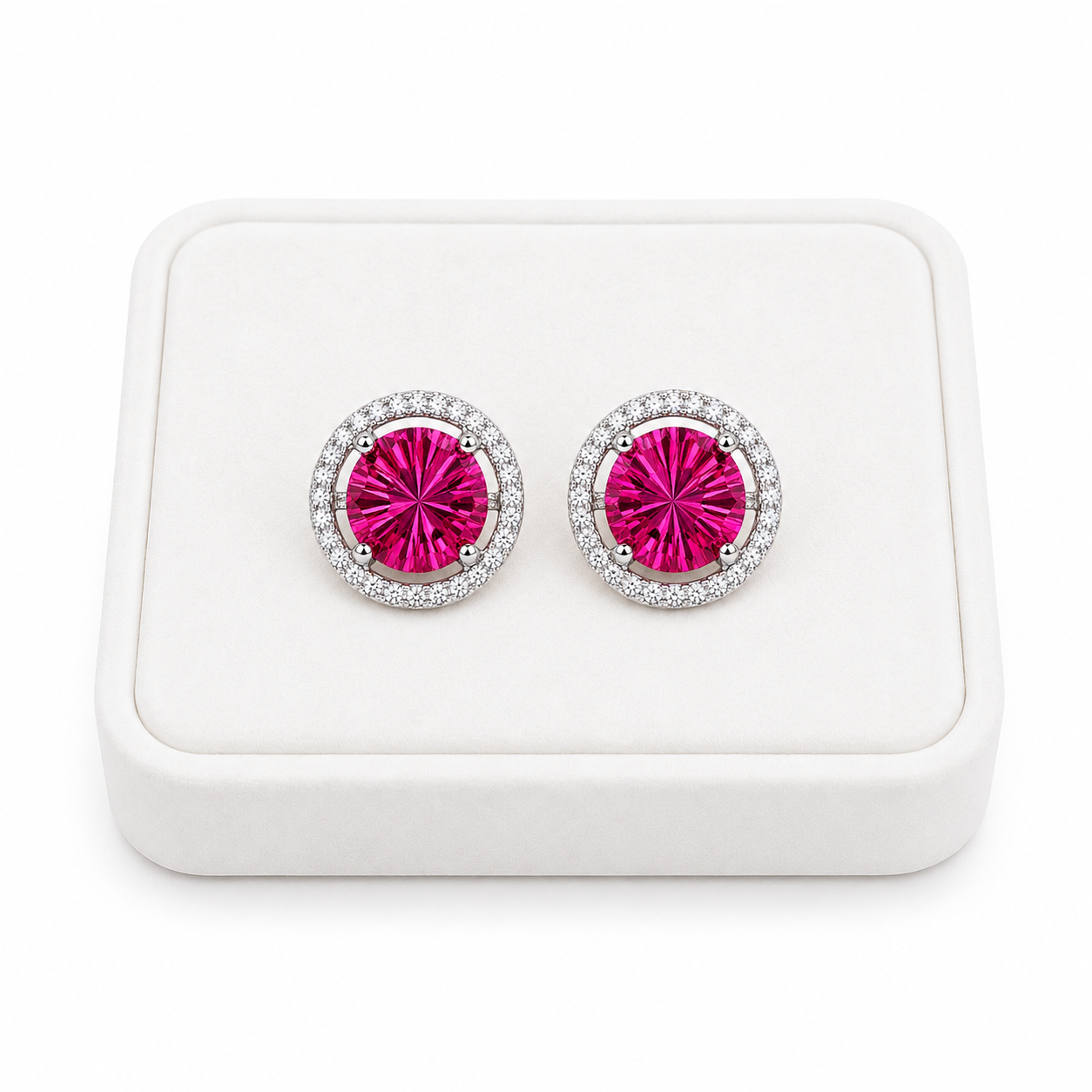 Natural 8mm pink topaz Firework Cut earrings displayed on a white jewelry tray