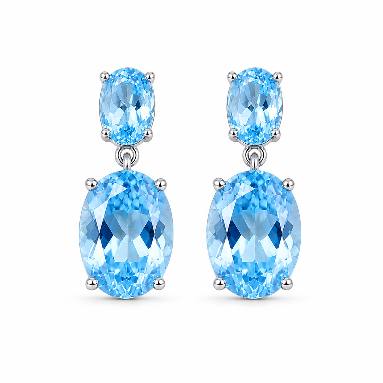 Front view of natural Sky Blue Topaz earrings with graduated oval gemstones