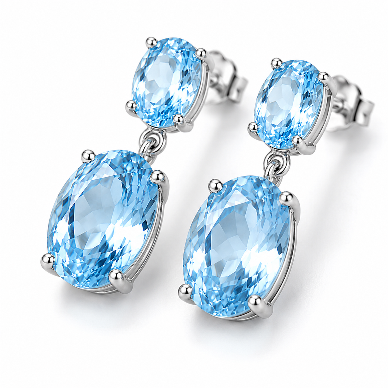 Close-up of faceted Sky Blue Topaz gemstones in 925 Sterling Silver earrings
