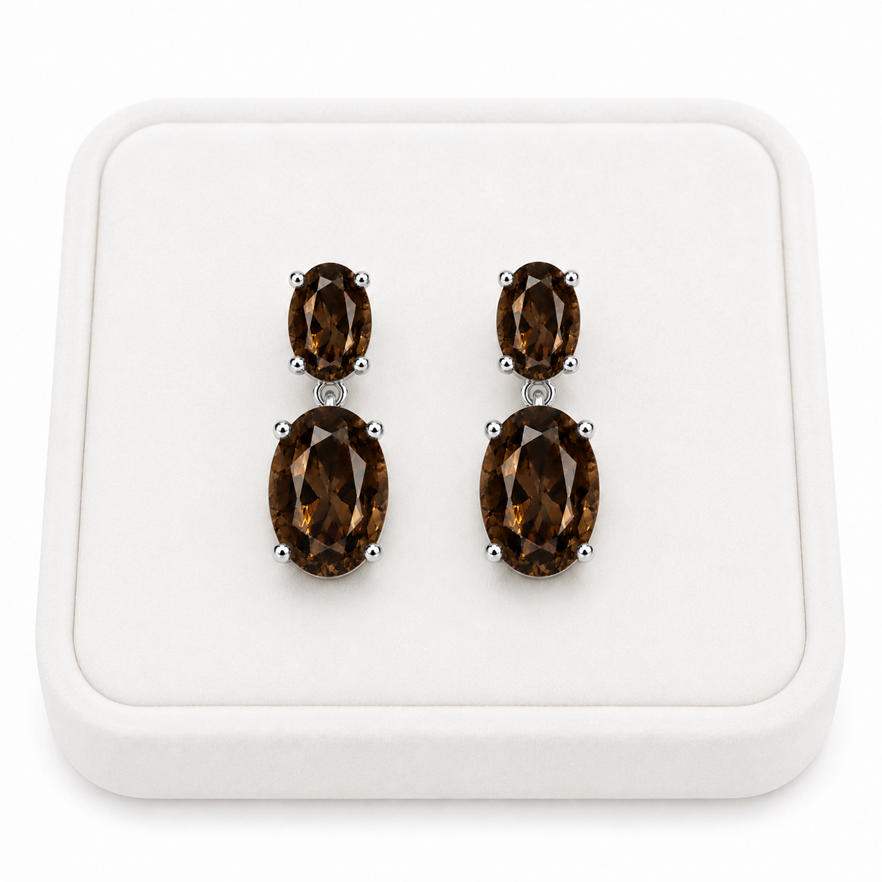 Natural smoky quartz dangle earrings with 4x6mm and 8x10mm oval gemstones on a White Tray