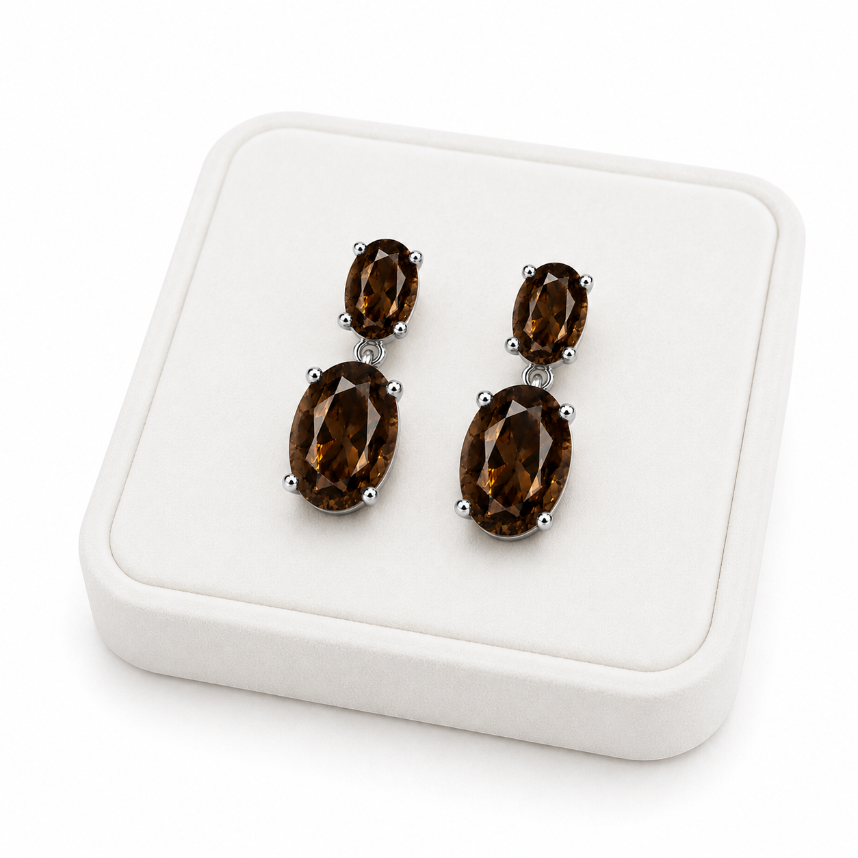Natural smoky quartz dangle earrings with 4x6mm and 8x10mm oval gemstones on a White Tray