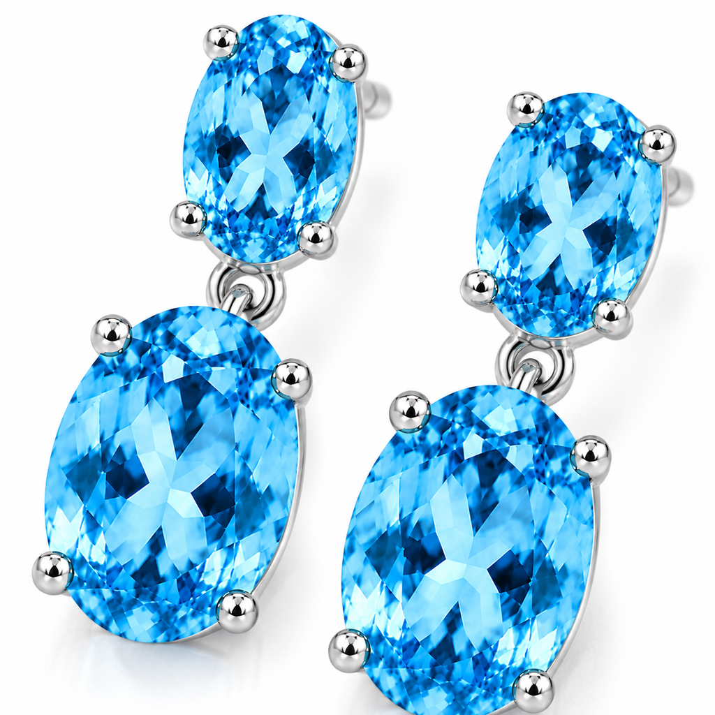Close-up of faceted Swiss Blue Topaz gemstones in elegant sterling silver dangle earrings