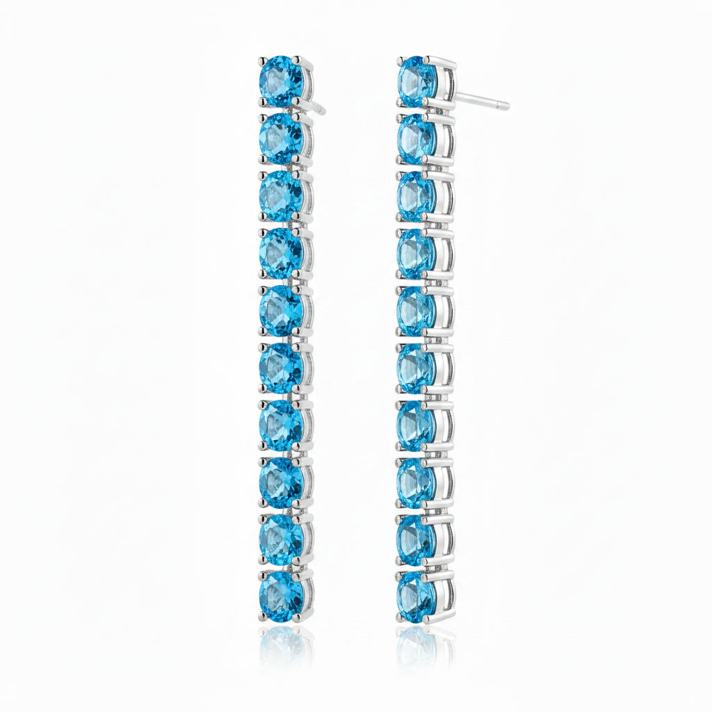 Swiss Blue Topaz dangle earrings shown from a three-quarter angle