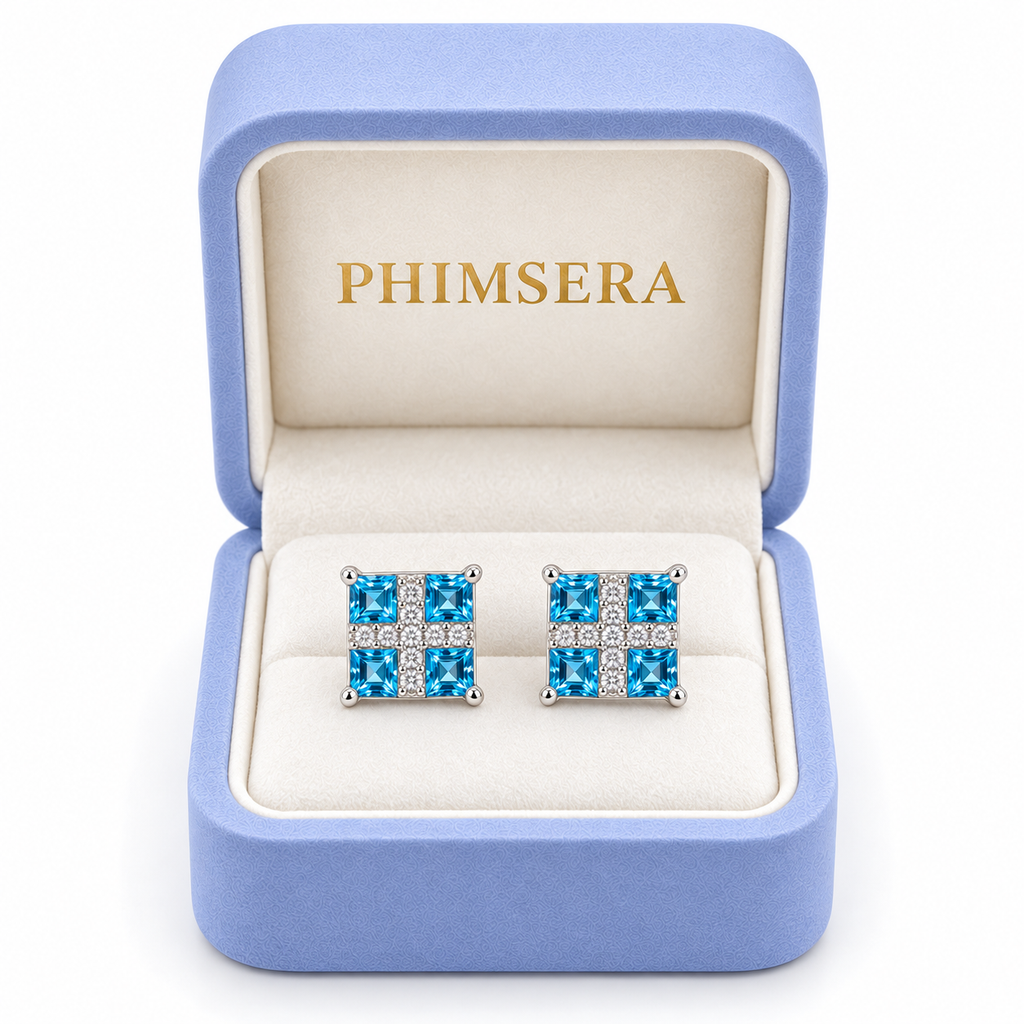 Swiss Blue Topaz square stud earrings displayed in a Phimsera jewelry box