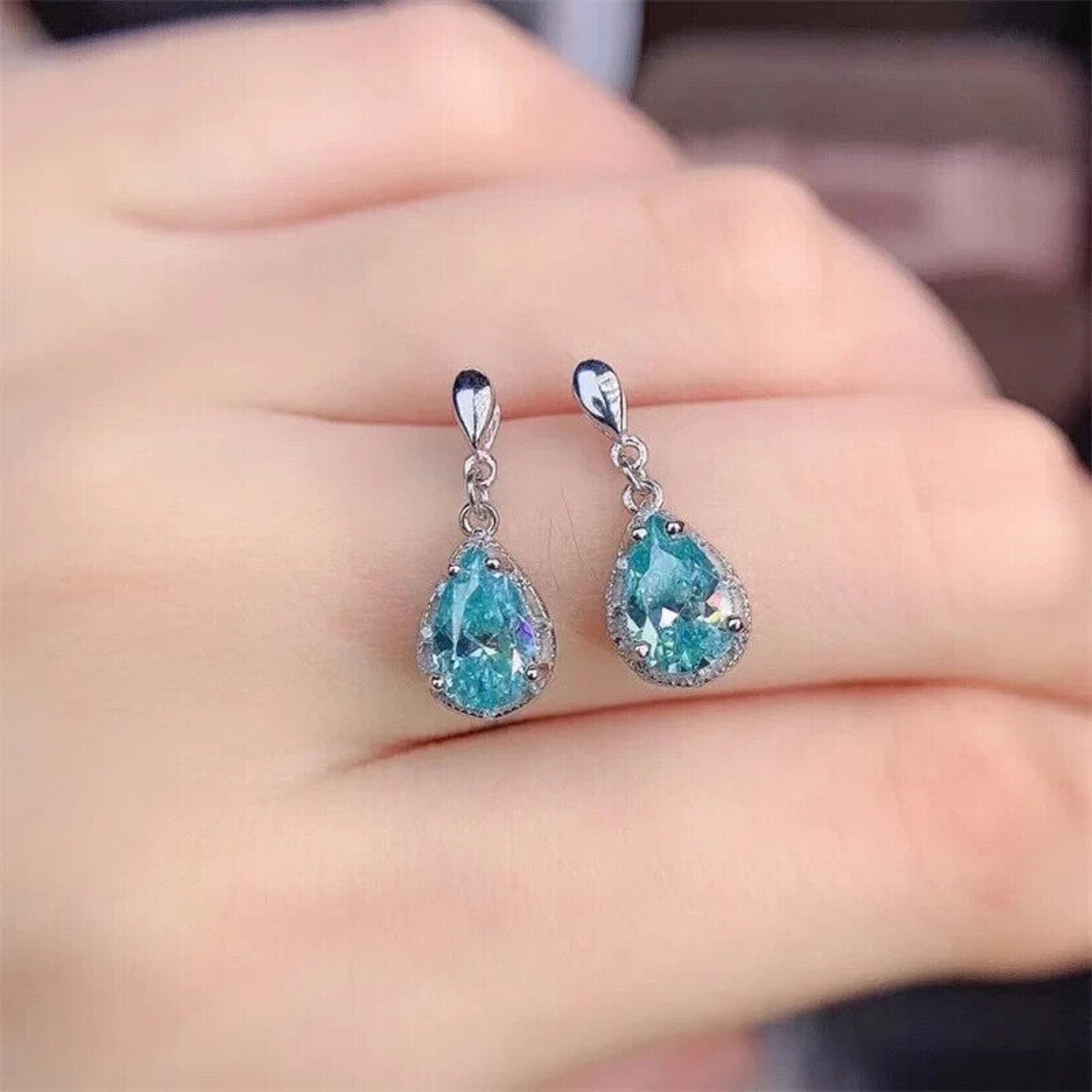 Moissanite Earrings, Moissanite Stud Earrings, Moissanite, White Moissanite, Green Moissanite, Moissanite Earrings Sterling Silver, VVS1 Moissanite Earrings, Green Moissanite Earrings, Green Moissanite Stud Earrings, Half Carat Moissanite Earrings, Women’s Green Moissanite Earrings, Green Moissanite Jewelry, Moissanite Jewelry, Round Brilliant Cut, Blue Moissanite, Blue Moissanite Earrings