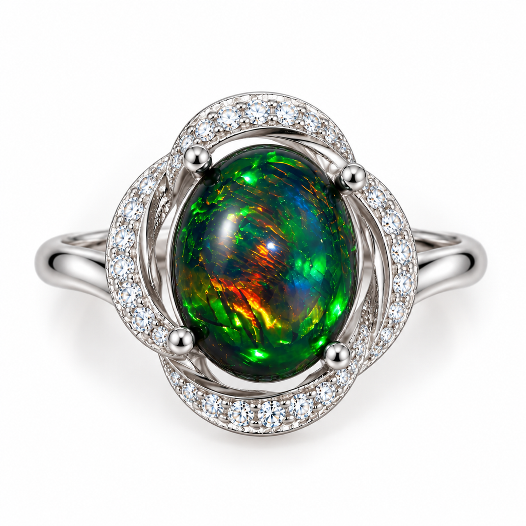 Top view of an oval Australian fire opal dyed black with vivid multicolor flashes and clear accent stones.
