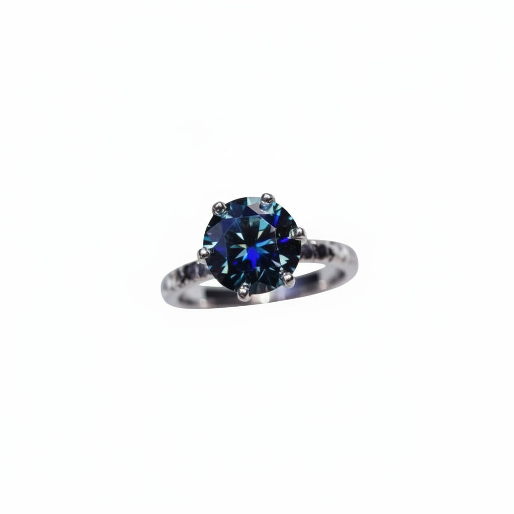 2 carat dark blue round moissanite solitaire ring in platinum plated 925 sterling silver on a white background