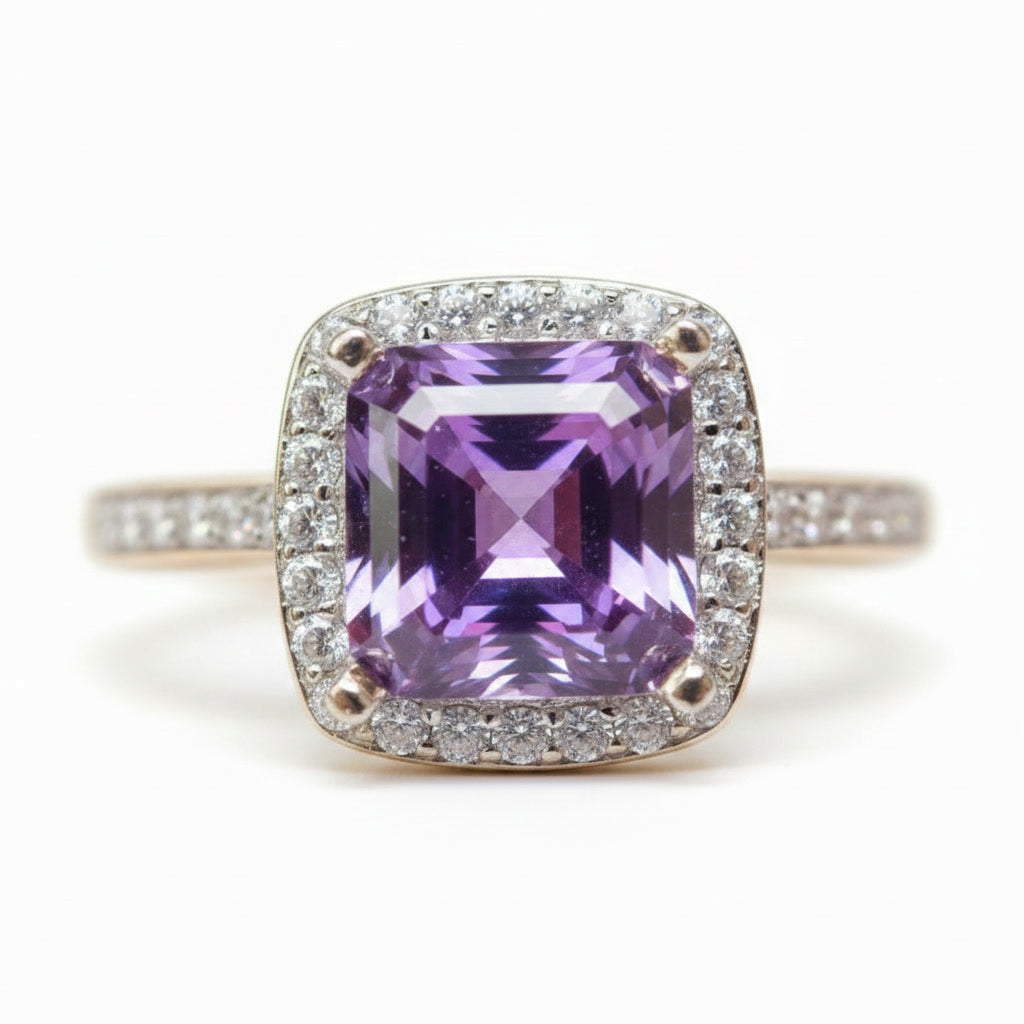 Purple Asscher cut moissanite halo ring featuring a 6×6mm lab-created center stone surrounded by sparkling cubic zirconia in sterling silver.
