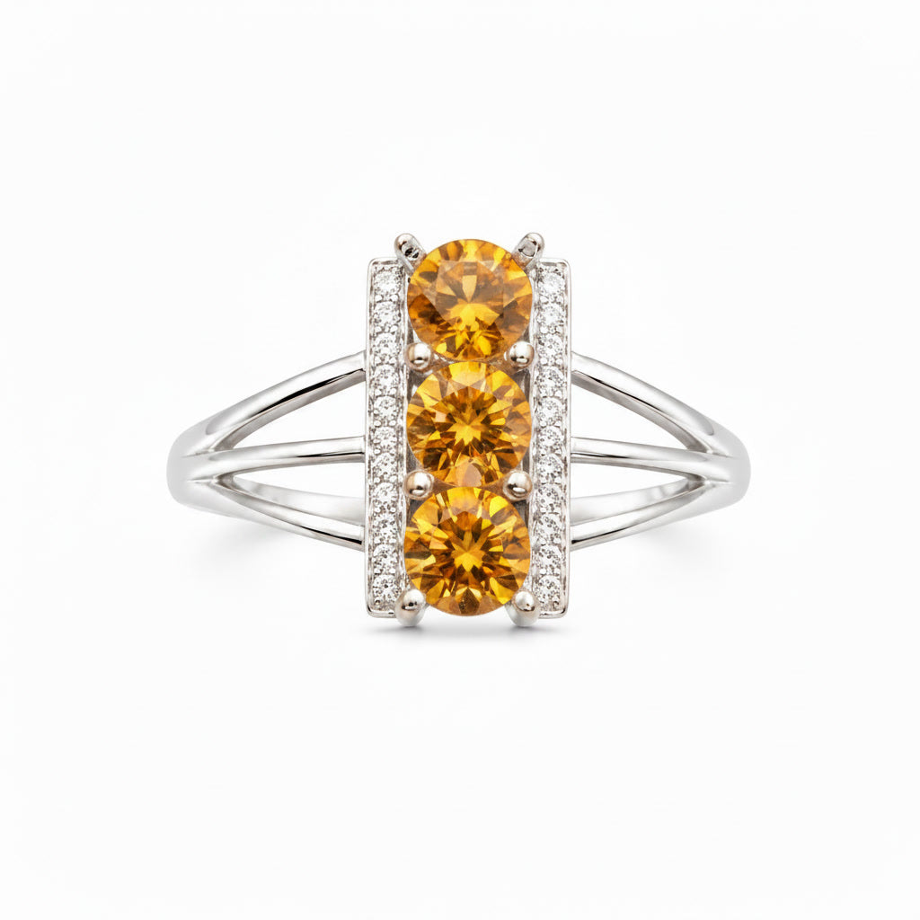 Top view of three 5mm natural citrine gemstones in sterling silver ring