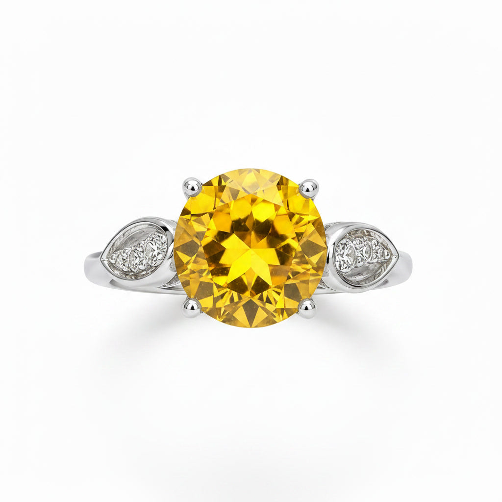 Top view of natural round citrine ring with sparkling leaf side accents