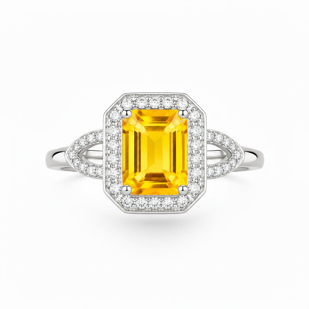 Top view of 6x8mm natural citrine ring with geometric CZ halo