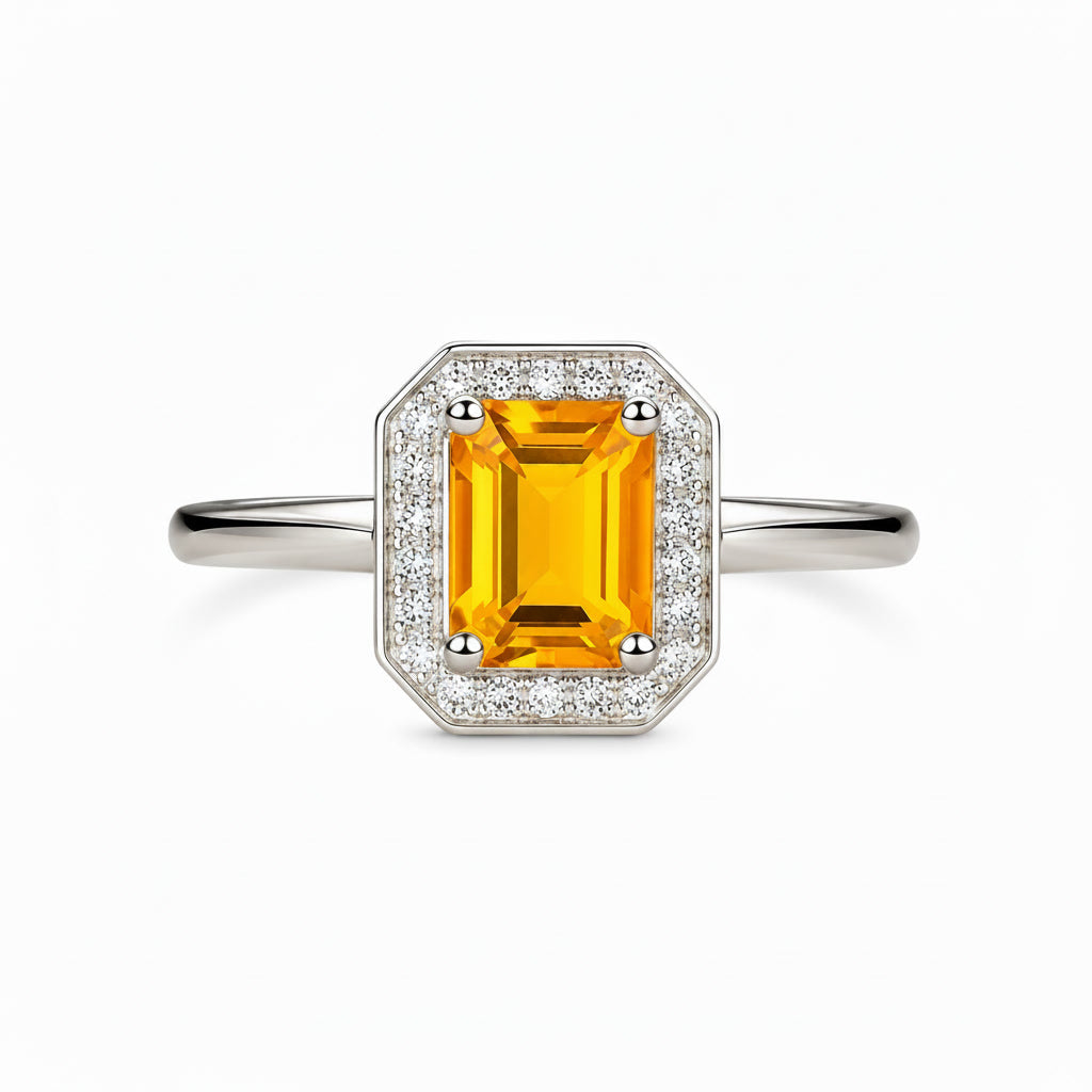 Top view of 6x8mm natural citrine ring with geometric CZ halo