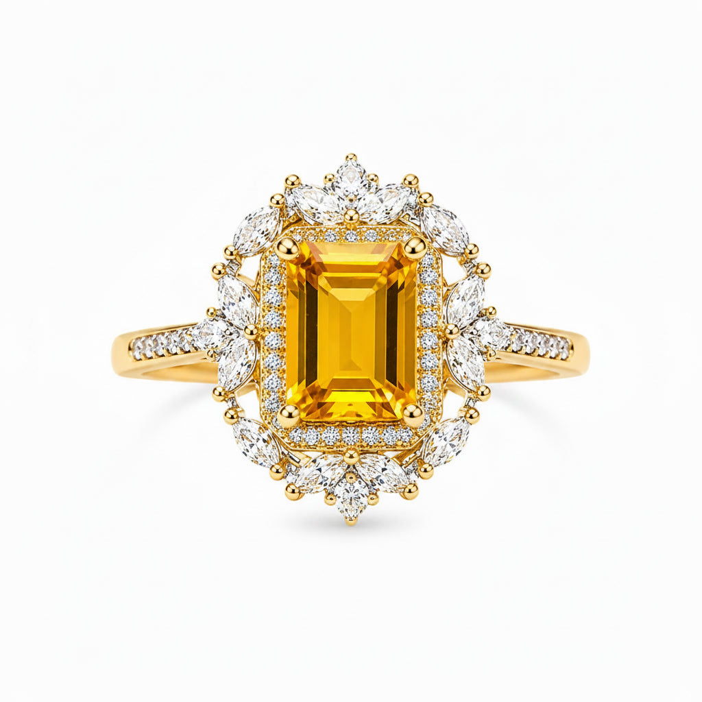 Top view of emerald cut natural citrine ring with white marquise and round accent stones