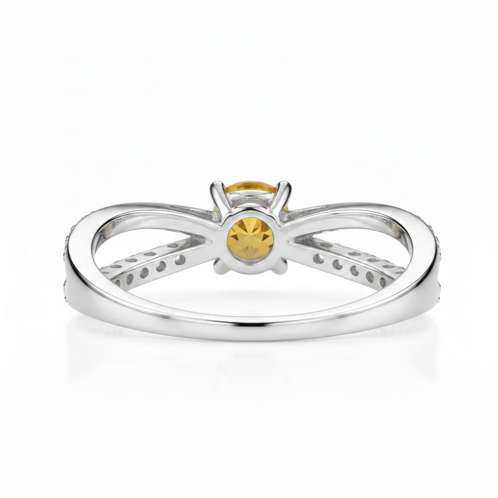 Side profile of natural 4mm citrine crossover ring in sterling silver