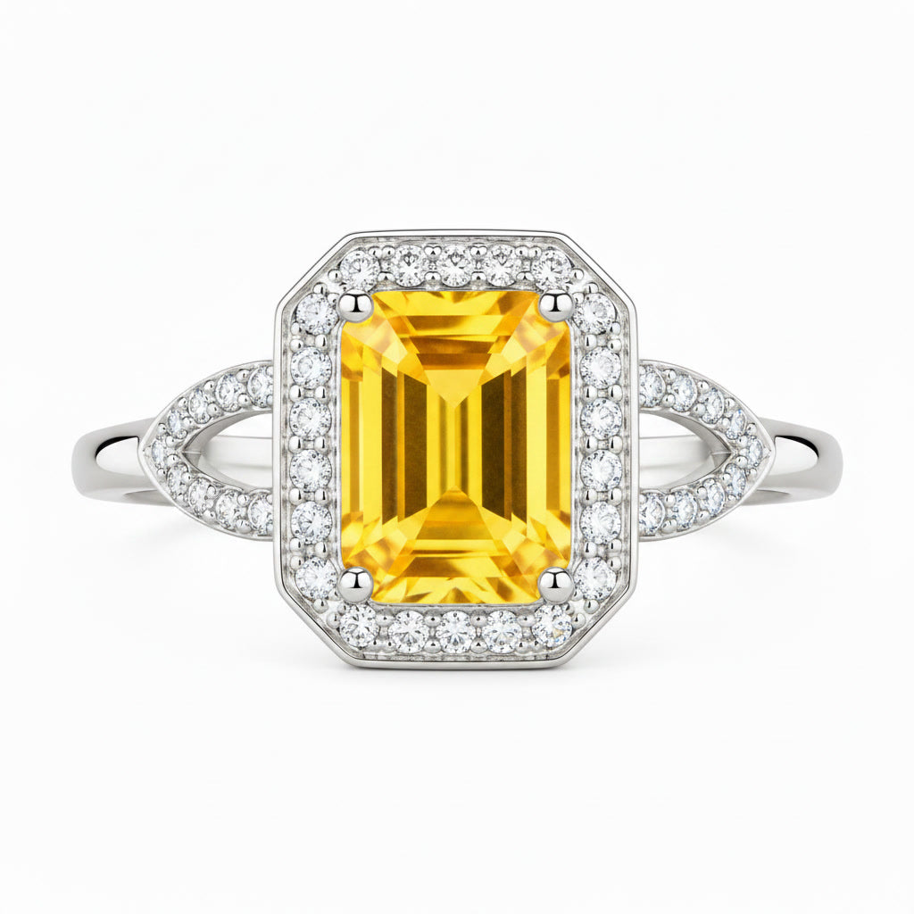 Close-up of 6x8mm emerald cut natural citrine gemstone and sparkling CZ halo