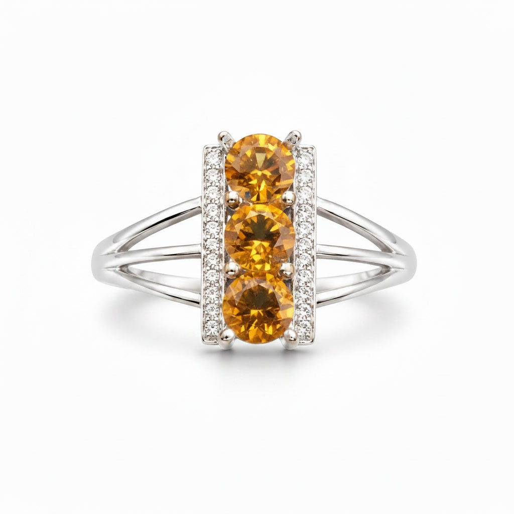 Close-up of three 5mm round natural citrine gemstones and sparkling CZ accents