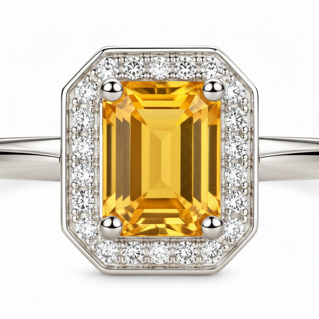 Close-up of 6x8mm emerald cut natural citrine gemstone and sparkling CZ halo