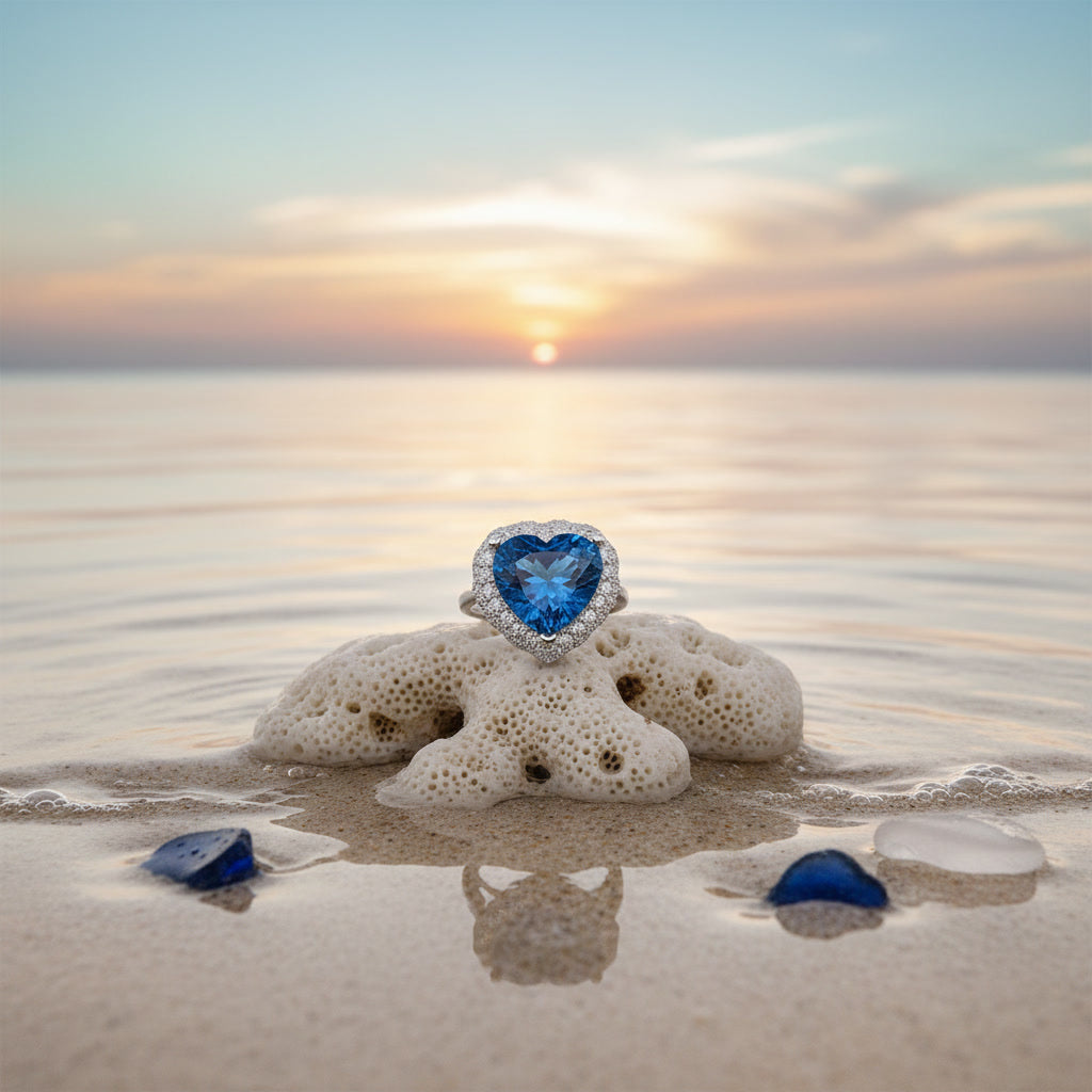 Natural London Blue Topaz heart ring featuring a 5.8 CT 10mm heart-cut gemstone surrounded by a sparkling cubic zirconia halo in sterling silver.
