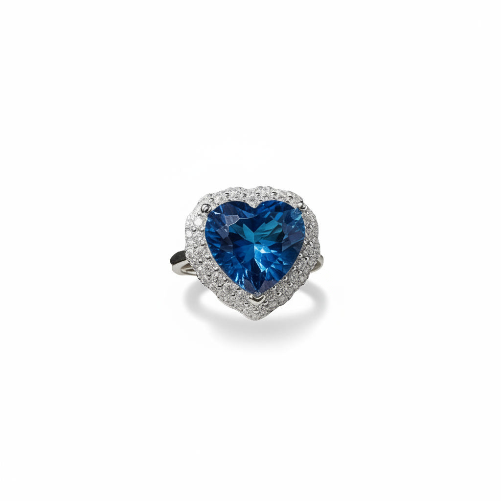Natural London Blue Topaz heart ring featuring a 5.8 CT 10mm heart-cut gemstone surrounded by a sparkling cubic zirconia halo in sterling silver.