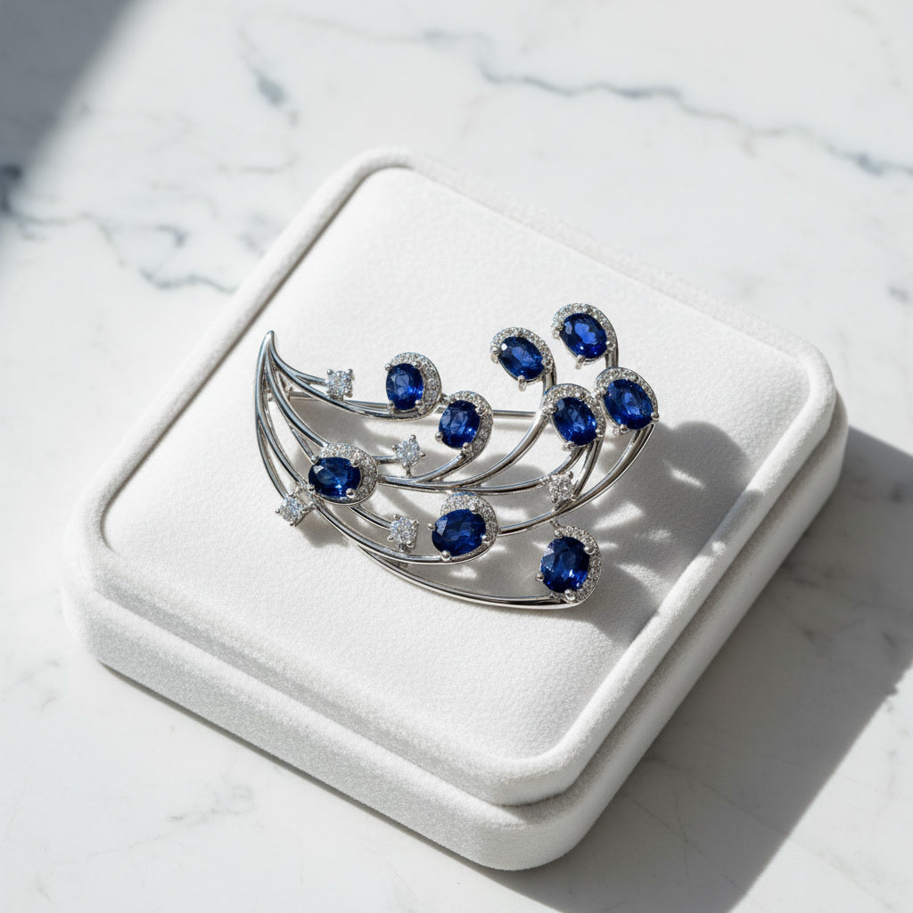 Natural Blue Sri Lanka Sapphire Brooch Pin in 925 Sterling Silver featuring nine 4x5 mm oval natural sapphires with cubic zirconia accents