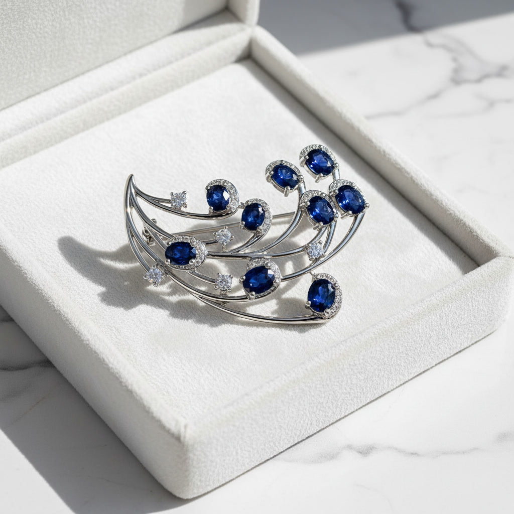 Natural Blue Sri Lanka Sapphire Brooch Pin in 925 Sterling Silver featuring nine 4x5 mm oval natural sapphires with cubic zirconia accents