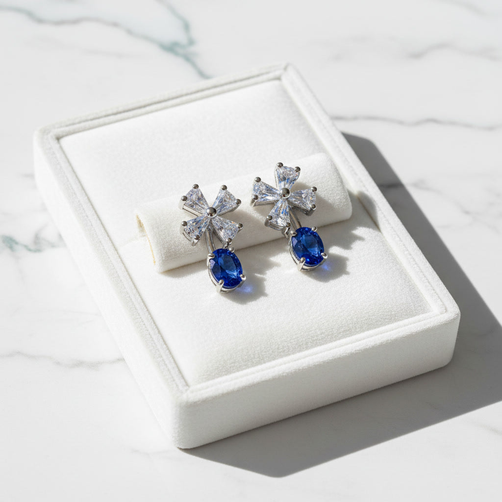 Natural Blue Sri Lanka Sapphire dainty stud earrings in 925 sterling silver featuring genuine 3×4 mm oval Ceylon sapphires with sparkling cubic zirconia accents