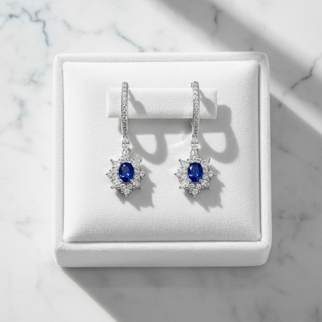Natural Blue Sri Lanka Sapphire hoop earrings in 925 sterling silver featuring genuine 3×4 mm oval Ceylon sapphires with sparkling cubic zirconia accents