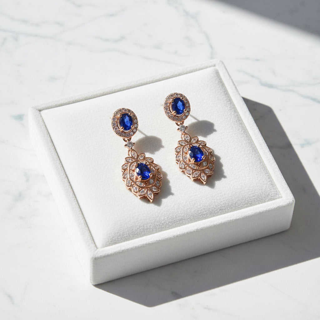 Natural Blue Sapphire elegant dangle earrings in 925 sterling silver featuring four VVS Grade 3×4 mm oval sapphires with sparkling cubic zirconia accents