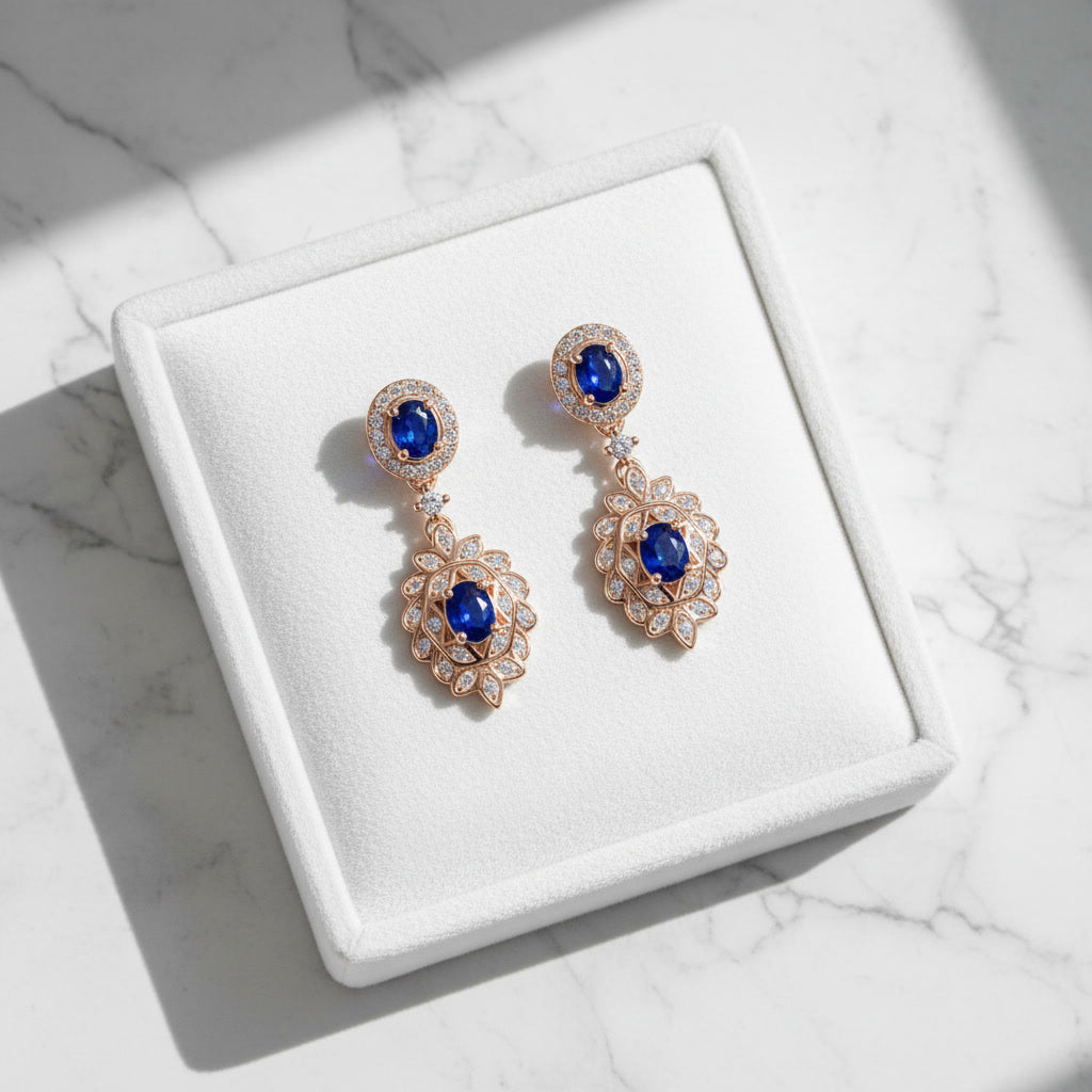 Natural Blue Sapphire elegant dangle earrings in 925 sterling silver featuring four VVS Grade 3×4 mm oval sapphires with sparkling cubic zirconia accents